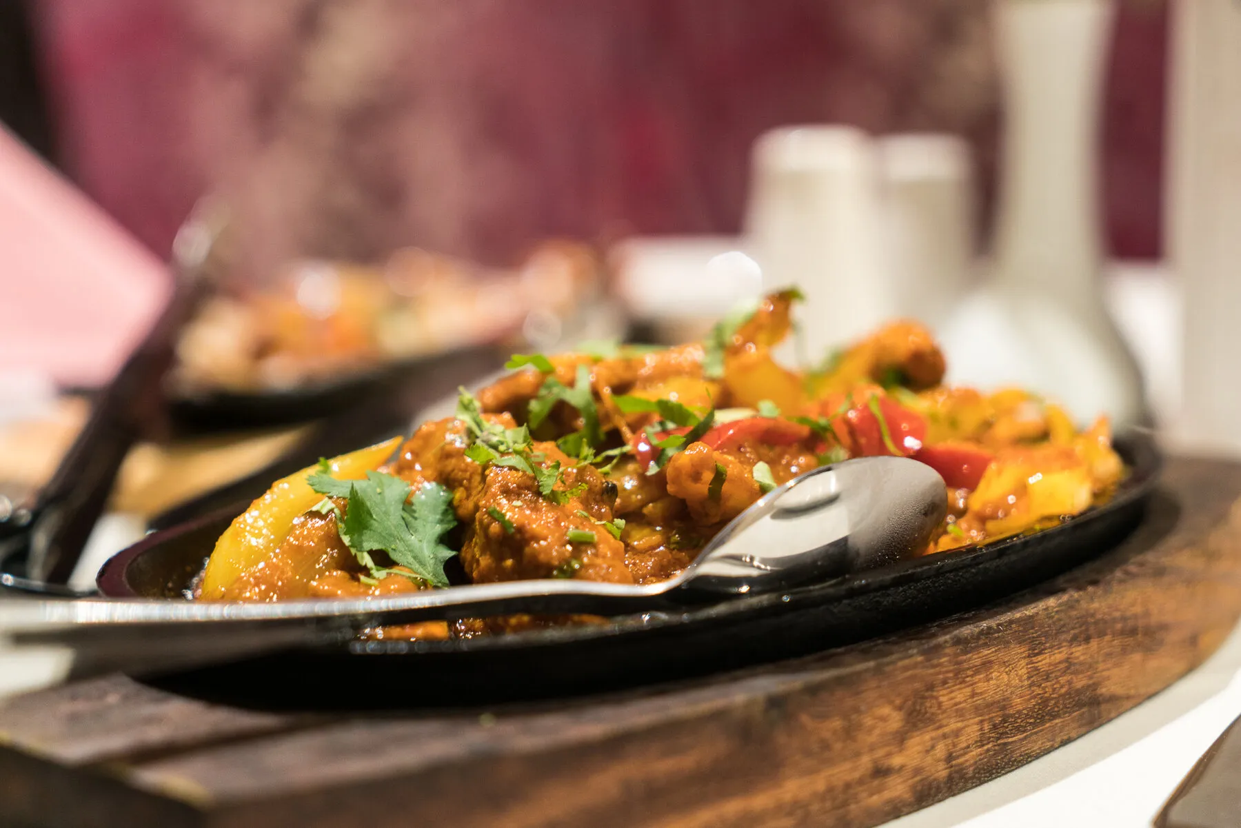 A tandoori mixed sizzler platter served at the table